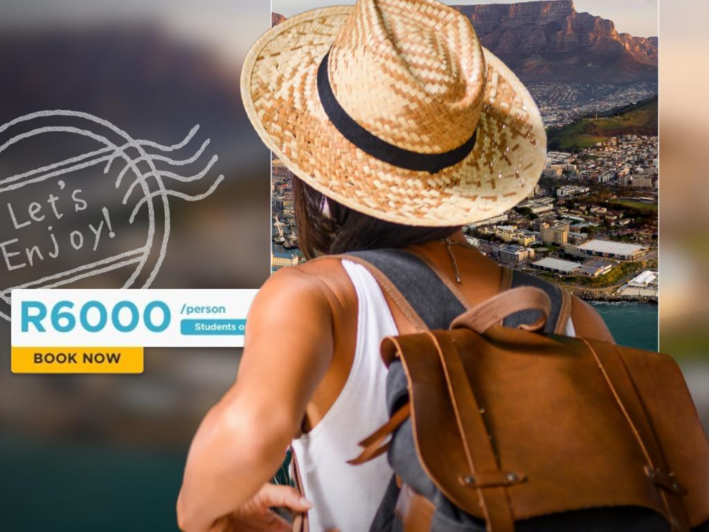 Student with summer hat and day backpack looking at Table Mountain and Cape Town in the background